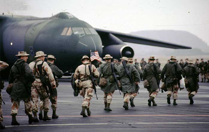 Soldiers deploying to the Gulf War make their way to a plane in 1990 at Volk Field, Wisconsin