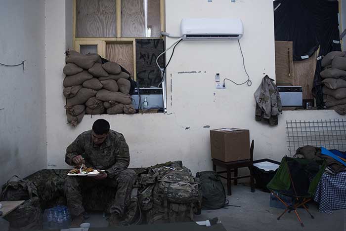 Service member eating a meal