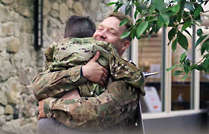 Service member reunited with their child