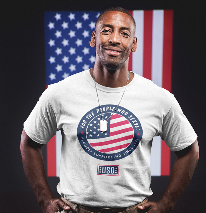 Smiling veteran wearing 2024 USO T-Shirt