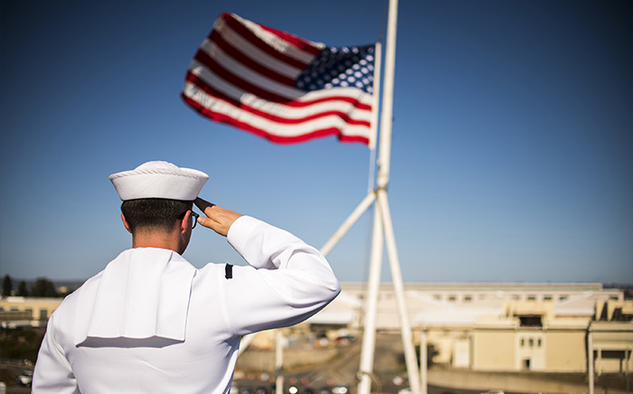 Service member saluting.