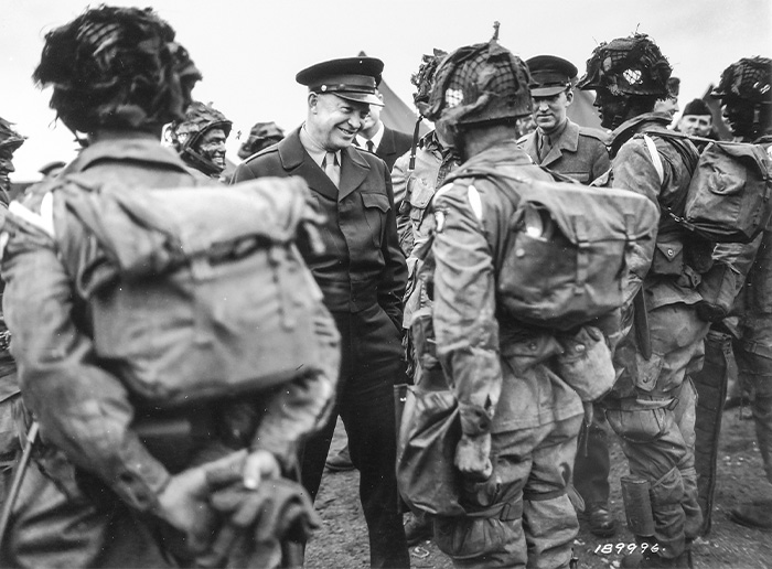 Troops speaking with former president.