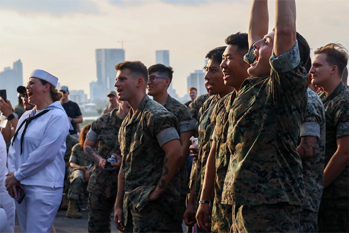 Service members cheering.