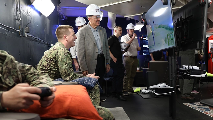 USO President and CEO Dr. J.D. Crouch II tours new aircraft carrier.