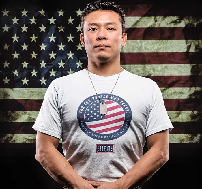 Man in USO T-Shirt with American Flag in the background