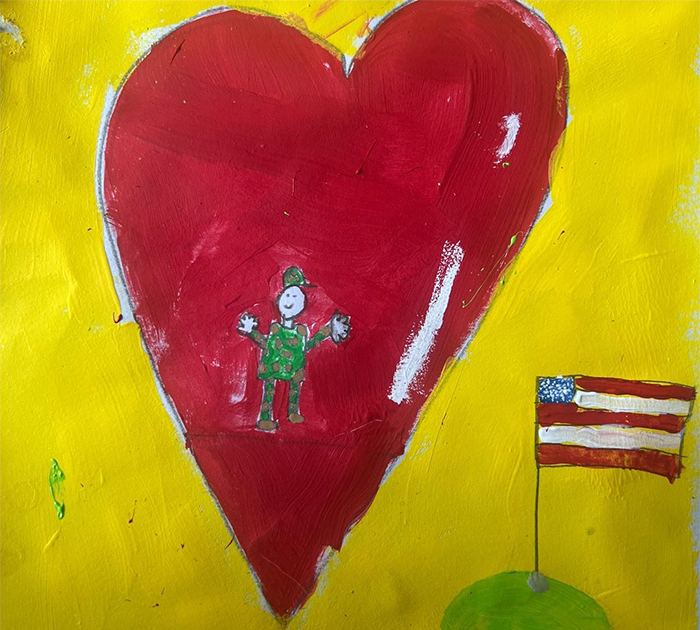 Drawing by Annalyn M. of her father in a heart beside the American flag.