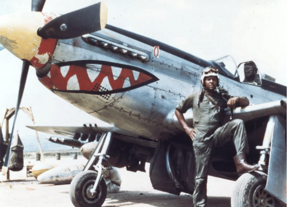 Photo of Daniel “Chappie” James Jr. in front of fighter plane