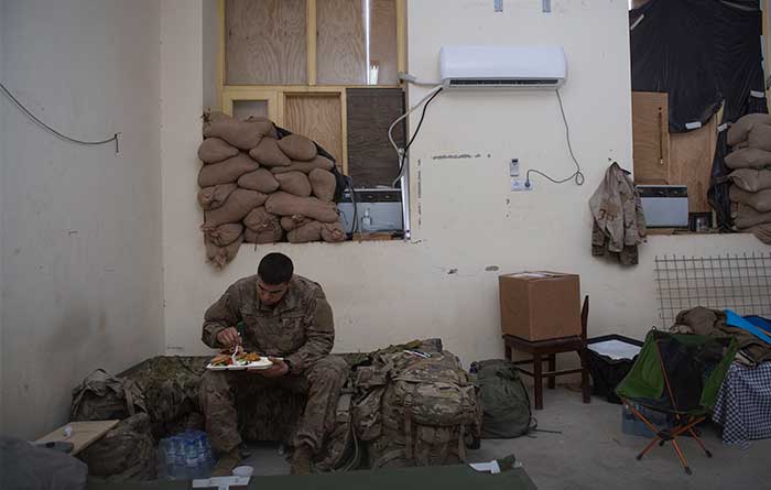 Serviceman eating a home-cooked meal while deployed.
