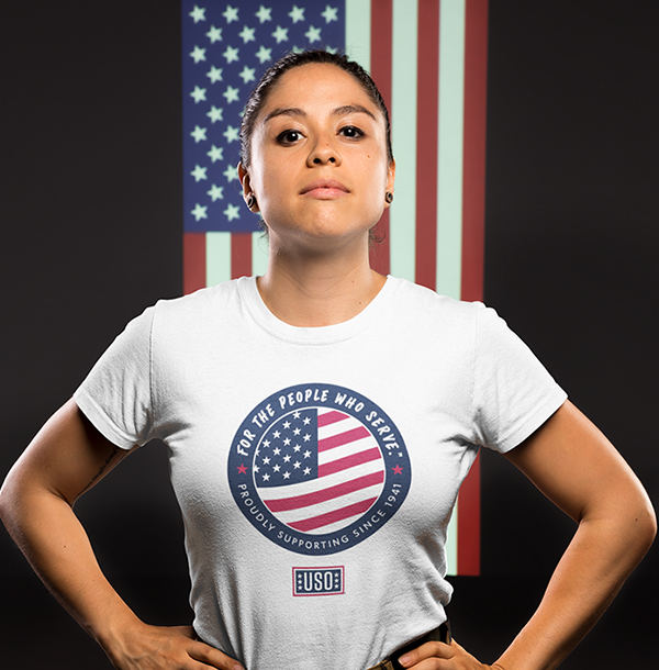 Person wearing USO T-Shirt in front of American flag