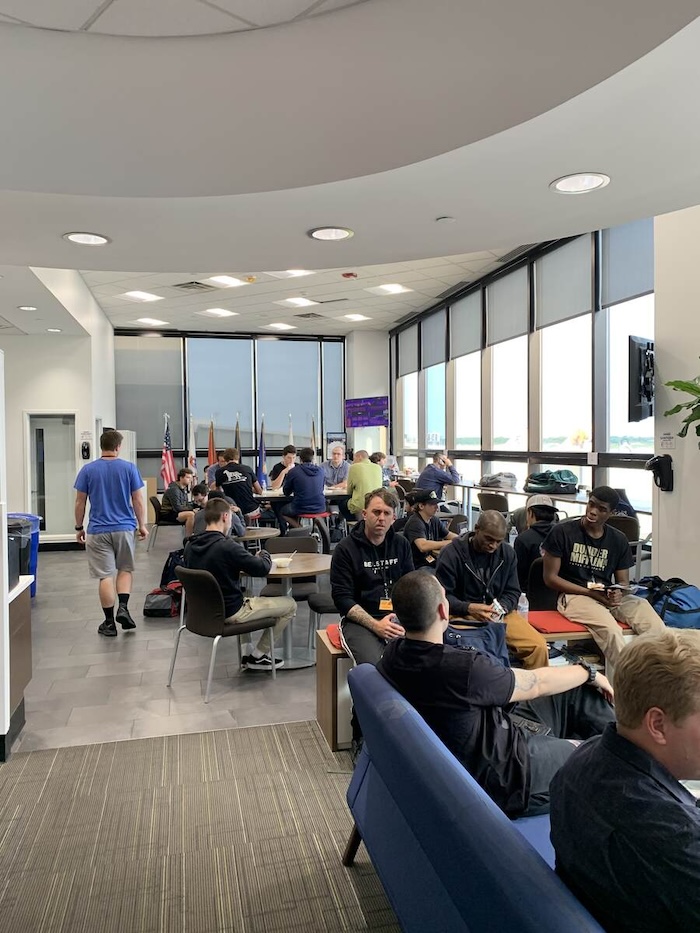 Coast Guard recruits relax at the airport lounge at USO at Philadelphia International Airport.