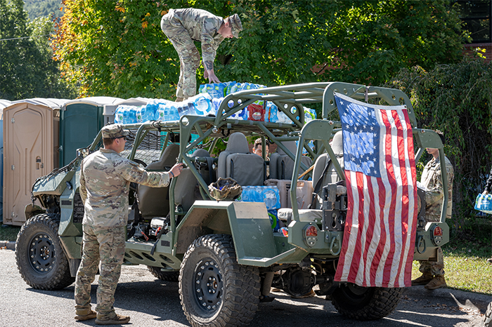 Service members deliver essentials, including water, in North Carolina