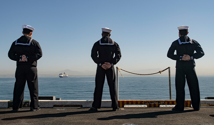 Service members manning the rails.