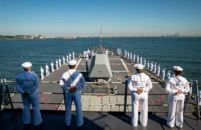 Service members manning the rails.