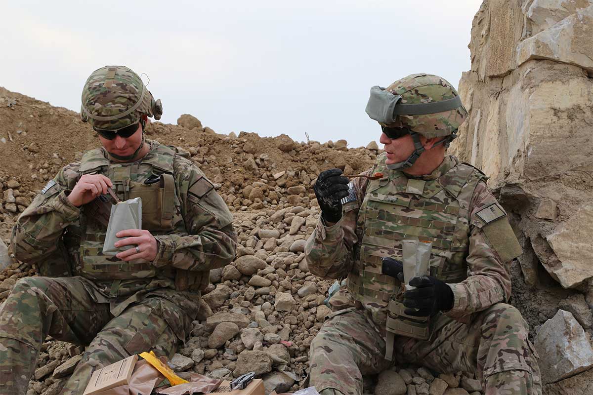 Service members eating