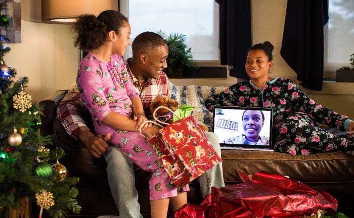 Image of family connecting with loved ones during the holidays