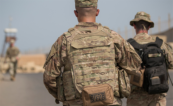 Service Members with USO backpacks