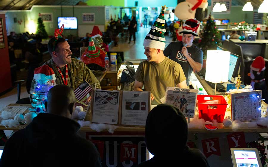 Service members and USO volunteers enjoying the holidays.