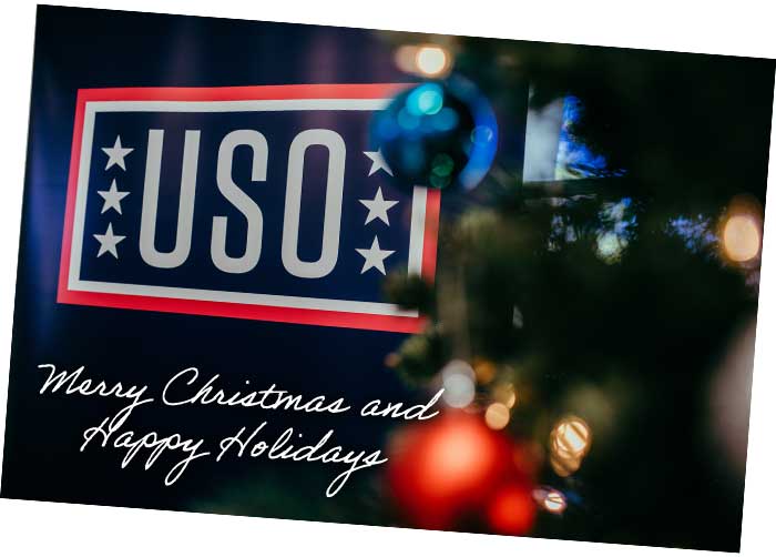 USO logo next to a Christmas tree with ornaments and lights