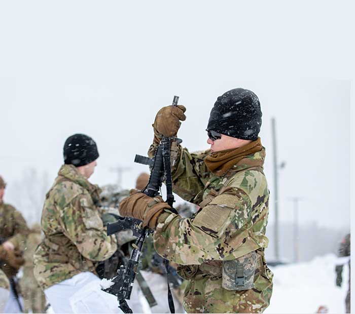 Service members in the snow