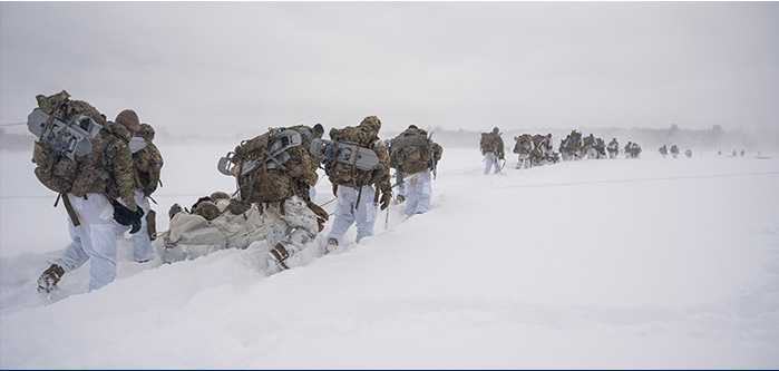 Service members trek through heavy snow 