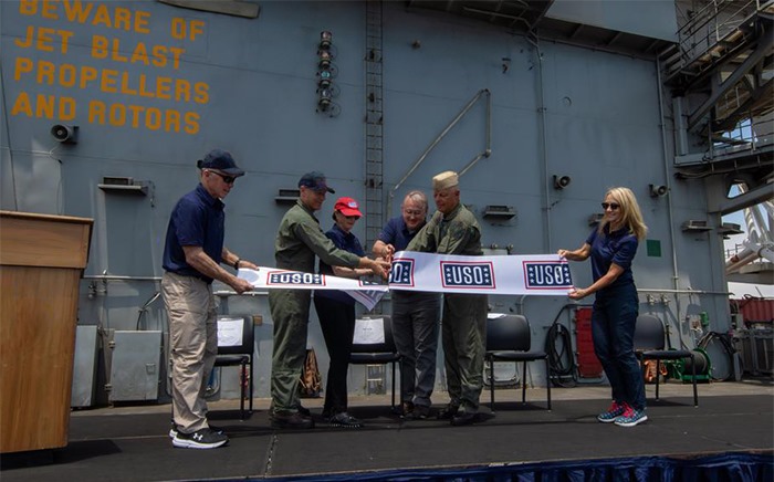 Ribbon cutting for the USO Center on the USS Abraham Lincoln.