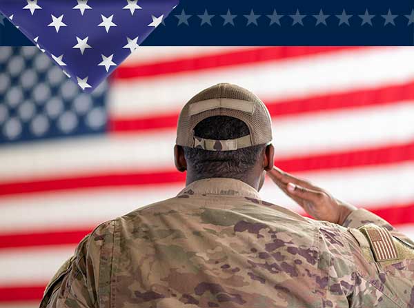 GIF of service members saluting the American flag.