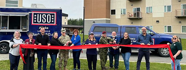 USO Volunteers at a ribbon cutting ceremony for the USO mobile center