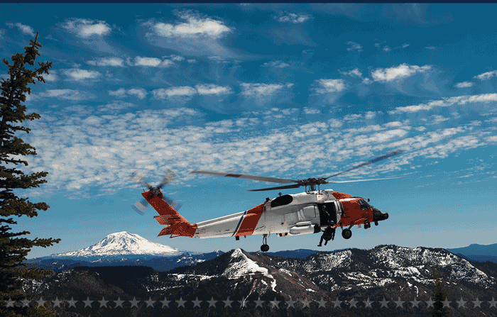 Image of Coast Guard boats and helicopters in action.