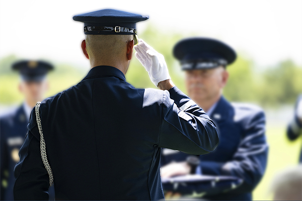 Service member stands at attention