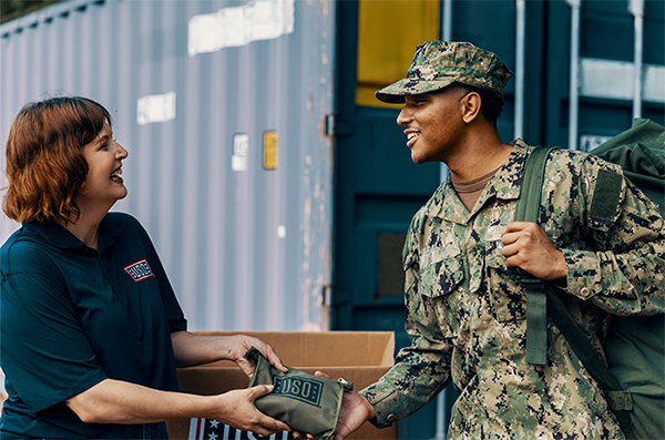 Service member receives USO aid.
