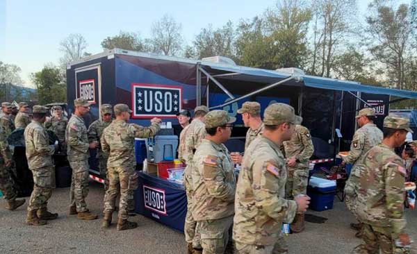 Image of USO mobile center and service members