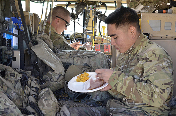 Service members enjoying a meal