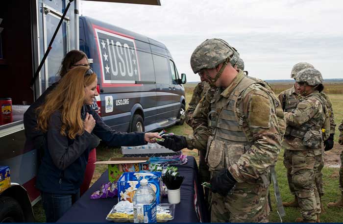 Service member holding care package
