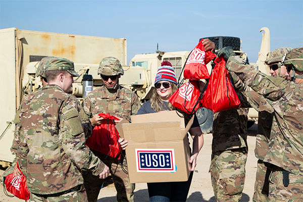 Service members receiving care packages from the USO