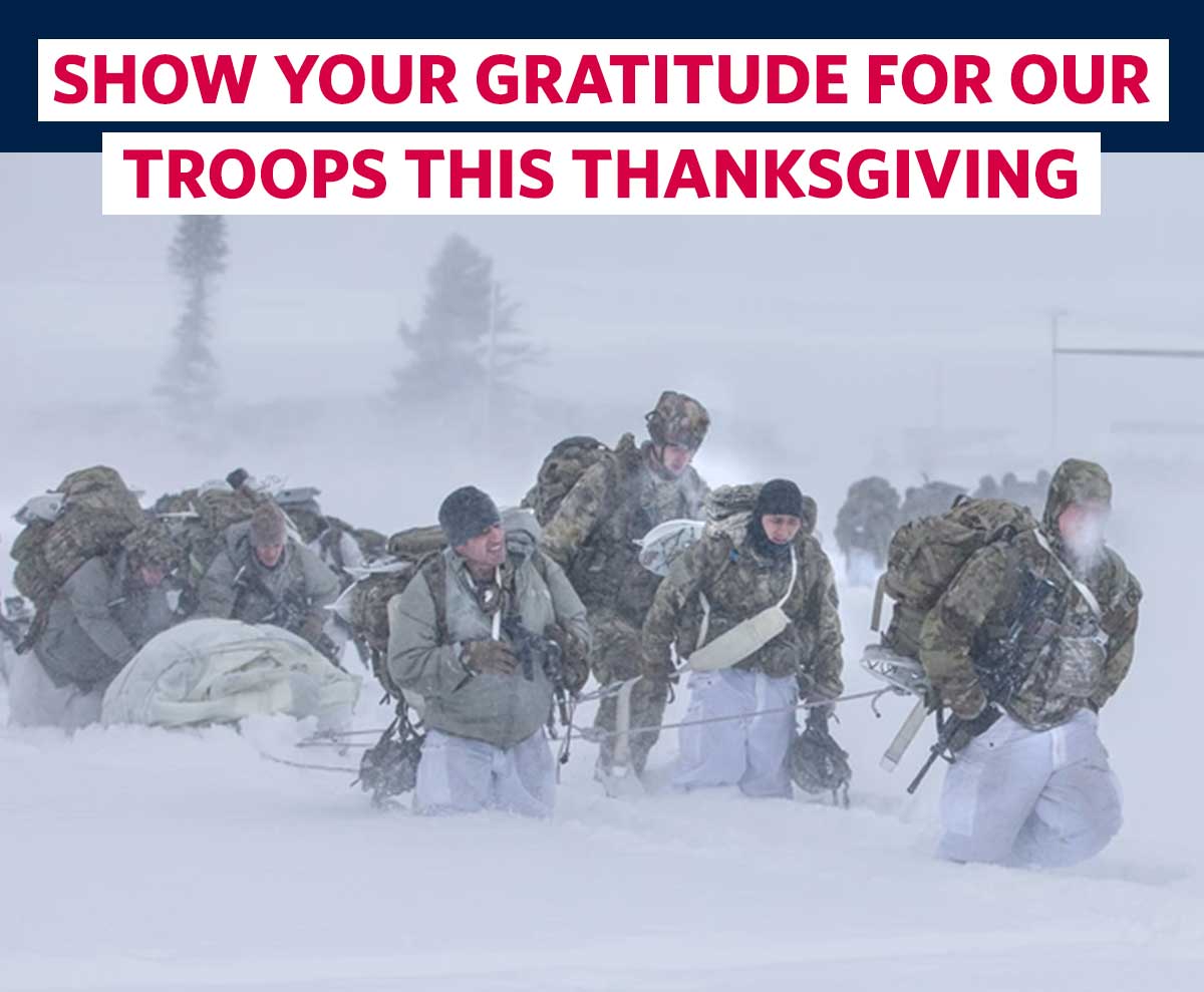 SHOW YOUR GRATITUDE FOR OUR TROOPS THIS THANKSGIVING. USO employee shares aid with a service member.