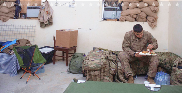 Service member eats meal alone.