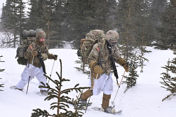 Troops walking through snow